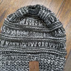 Women's Hat, with a ponytail or bun, open on top of the hat.